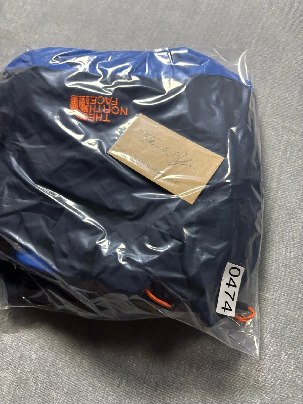 The North Face Navy & Royal Blue Hooded Rain Shell with Orange Accents